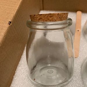 Small jars with cork lids and labels